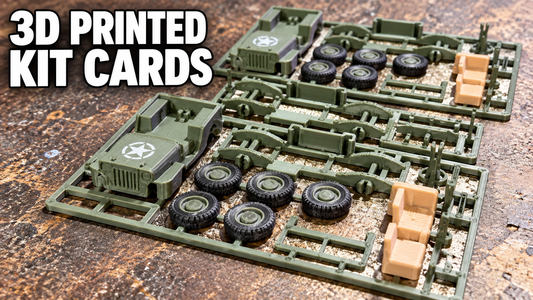 3D printed kit cards with olive-green Jeep parts, black wheels and tan seats on a workbench