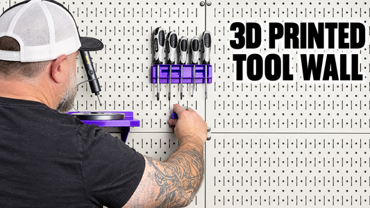 MakerBuildIt installing a purple 3D printed holder on a white metal tool wall