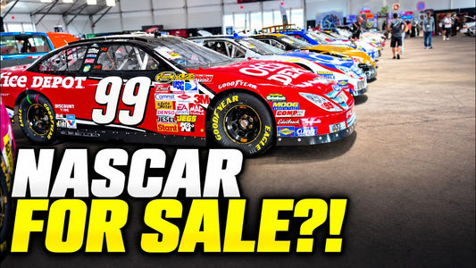 Red Office Depot number 99 Ford in a lineup of Roush NASCAR race cars at Mecum Nashville